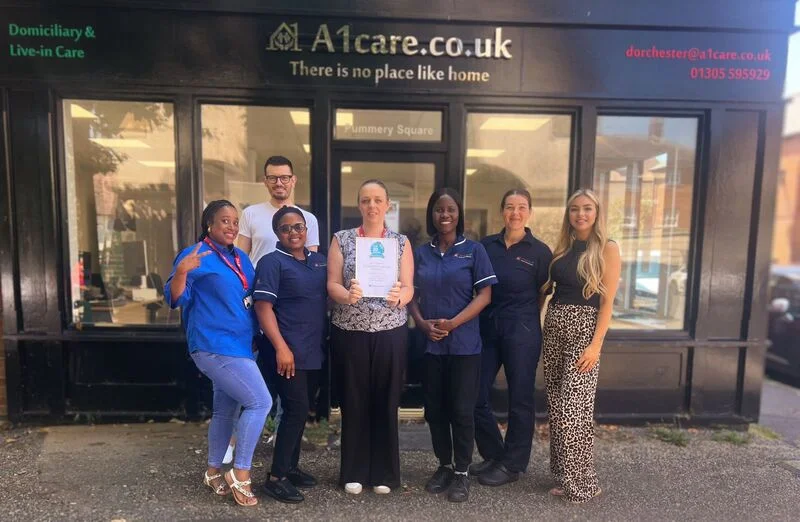 A1 Care Dorchester team outside the branch – trusted home care professionals providing domiciliary and live-in care services across Dorchester and Dorset.